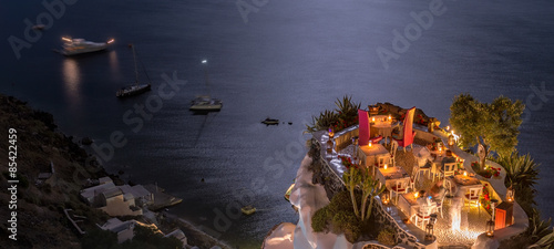 Terrace in front of the ocean. Restaurant with sea view at night