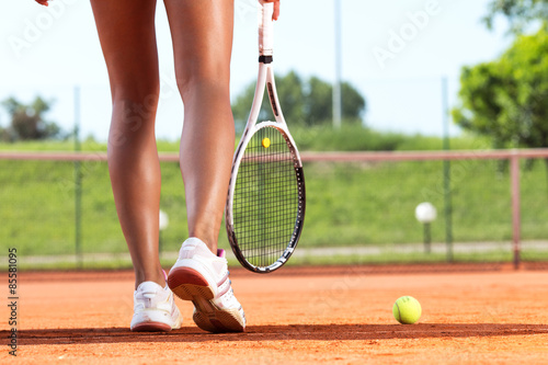 Obraz na plátně Legs of female tennis player.Close up image.