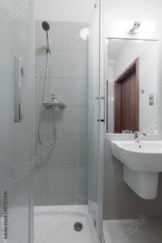 Fototapeta Toilet interior with shower cubicle