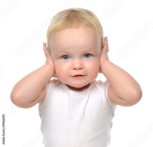 infant child baby toddler sitting closed her hands over ears and