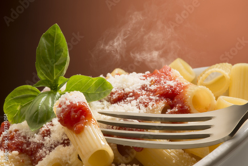 Poster dish with macaroni and tomato sauce