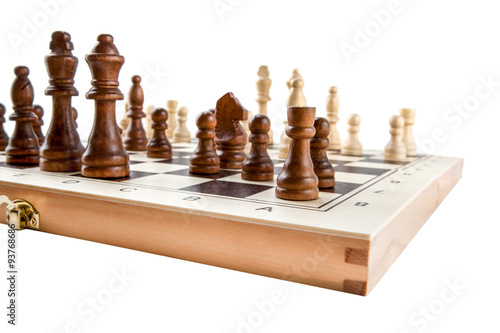 Valokuva Chess board with chess wooden pieces isolated on white