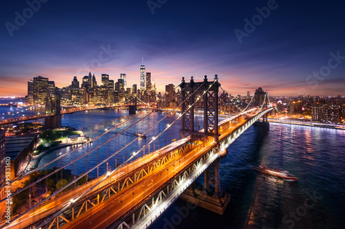 Obraz na płótnie New York City - beautiful sunset over manhattan with manhattan and brooklyn bridge