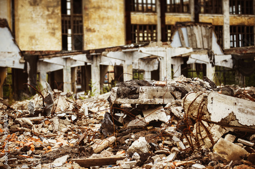 Poster A closeup image of a garbage dump at ruined building background