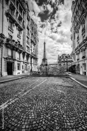  Eiffel Tower seen from the street in Paris, France. Black and white