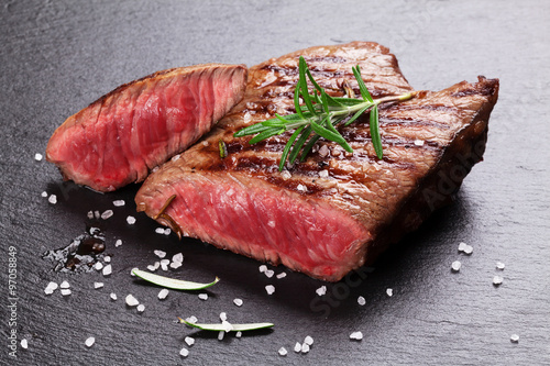 Zdjęcia Grilled beef steak with rosemary, salt and pepper