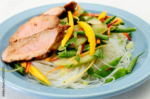 quot;grilled pork tenderloin with fresh sauteed vegetables over mangoquot; Stock photo and royaltyfree 