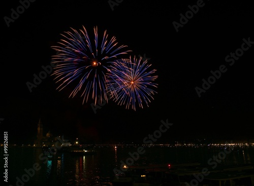 Poster Big colorful fireworks explode in Venice in dark sky,New Year fireworks in Venic
