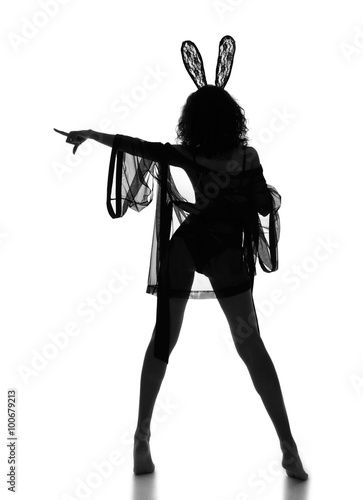 Poster woman point finger and posing dancing in casual cloth and bunny