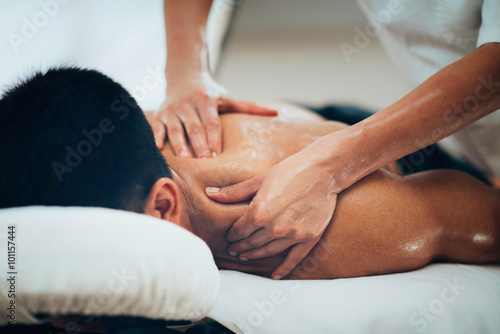 Poster, Tablou Sports massage. Therapist massaging shoulders
