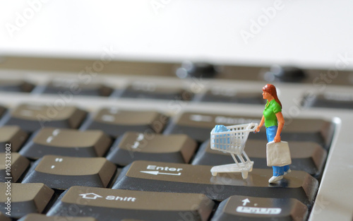 Miniature shopper with shopping cart