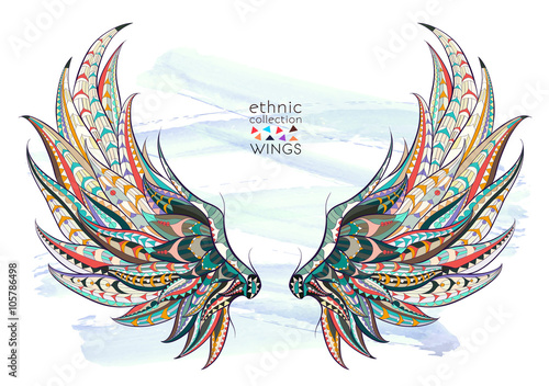 Fototapeta Patterned wings on the grunge background. African / indian / totem / tattoo design. It may be used for design of a t-shirt, bag, postcard, a poster and so on. 