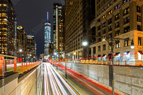 Poster Traffic trails in downtown New York City at the entrance in Battery Park tunnel