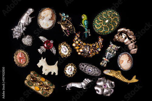Poster Antique and vintage jewelry collection isolated on a black background