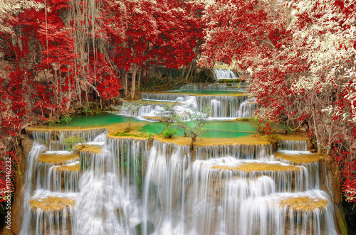 Fototapeta Waterfall in autumn forest.