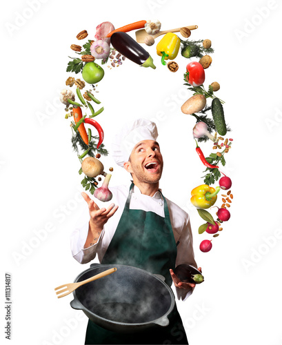 Chef juggling with vegetables and other food in the kitchen