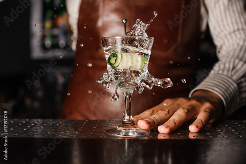 Poszter cucumber falling into the glass