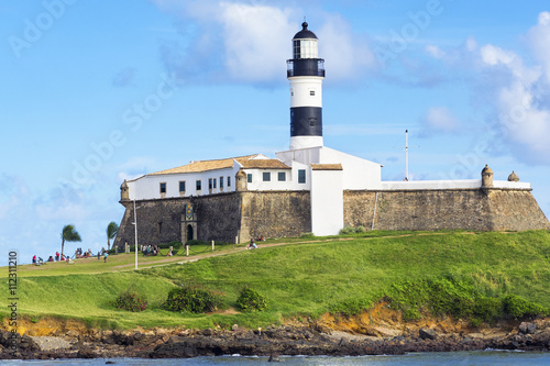 Obraz na płótnie View of Farol da Barra Lighthouse in Salvador da Bahia, Brazil. Dating from the year 1698, it is said to be the oldest lighthouse in South America.