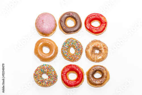 Poster Colorful glazed donuts, view form the top, isolated on white background
