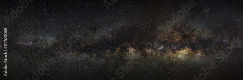 milky way galaxy on a night sky, long exposure photograph, with © Sarote