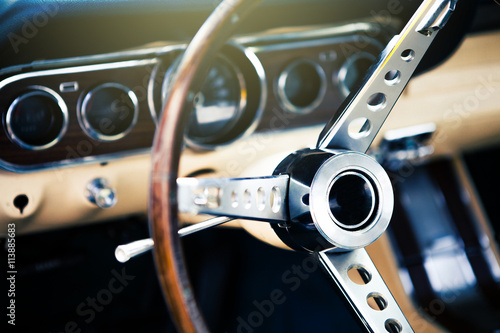 Poster Inside view of classic american muscle car, with focus on steering wheel