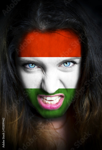 Poster Portrait of a woman with the flag of the Hungary painted on her face