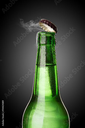Plagát, Obraz Cold wet beer bottle with frost and vapor
