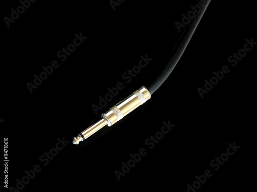 Poster Metal golden jack connector on black audio instrumental cable isolated on white