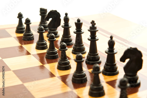 Valokuva black chess figures on a chessboard