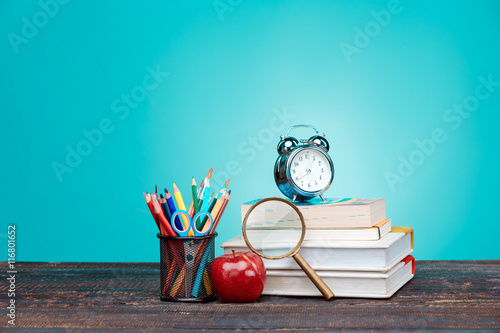 Stampa su Tela Back to School concept. Books, colored pencils and clock