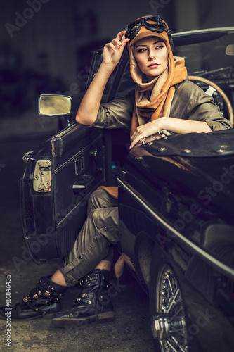 Audrey in an old car