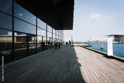 Poster Copenhagen pier with wooden walkway and sea infrastructure at sunny day, Denmark