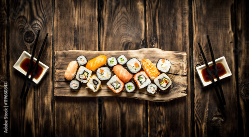 Sushi and rolls seafood with soy sauce.