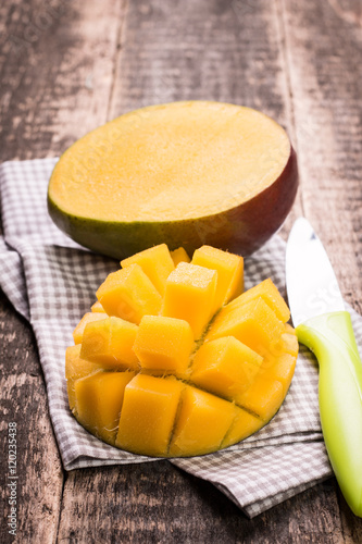 Fresh rip mango on a wooden background.Healthy food