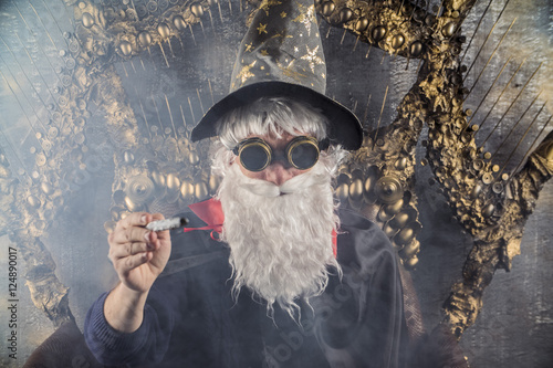 Poster
wizard Merlin conjures and casts a spell, raising his wand, a old man dressed