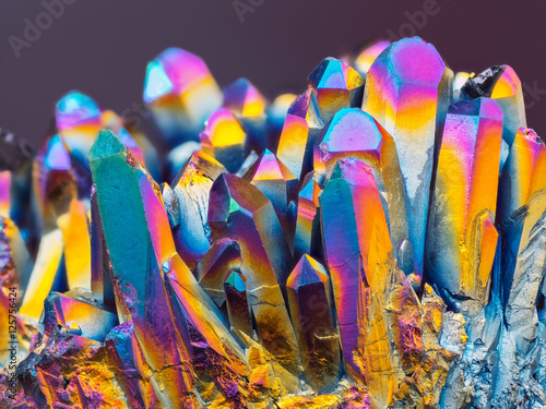 Extreme sharp Titanium rainbow aura quartz crystal cluster stone taken with macro lens stacked from more shots into one very sharp image with blurry background. © tomatito26