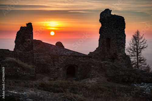 Poster The Ruins of Lichnice Castle in Czech Republic with sunset in background