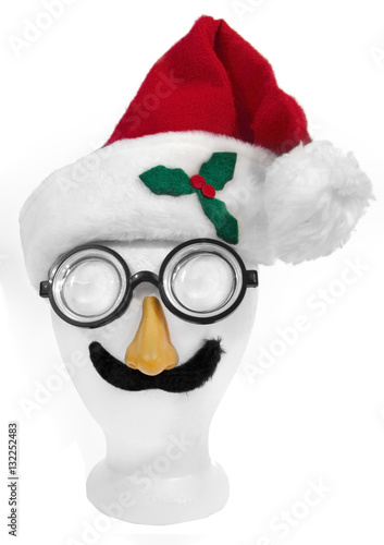 Poster Goofy Santa face: cap,nerd glasses, nose, and mustache on styrofoam mannequin head