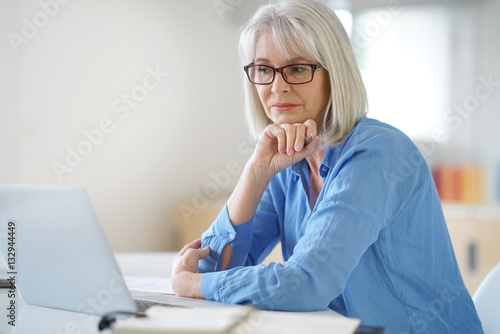 Senior businesswoman working in office