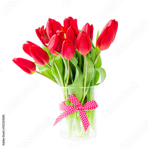 Obraz na płótnie Red tulips bouquet in vase. Isolated over white background 