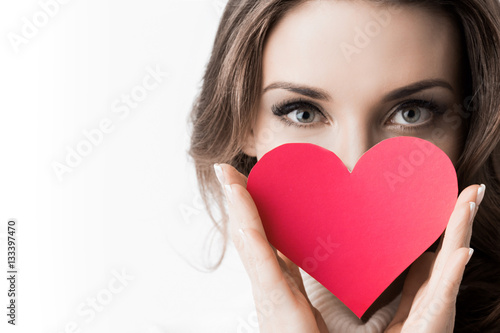 Girl holding paper heart