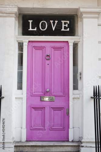 Poster Pink door with letters 'LOVE' found on a house in Chelsea, London, United Kingdom