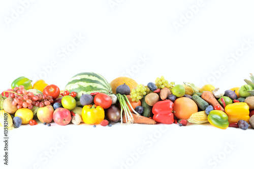 Ripe and tasty fruits and vegetables on a white background