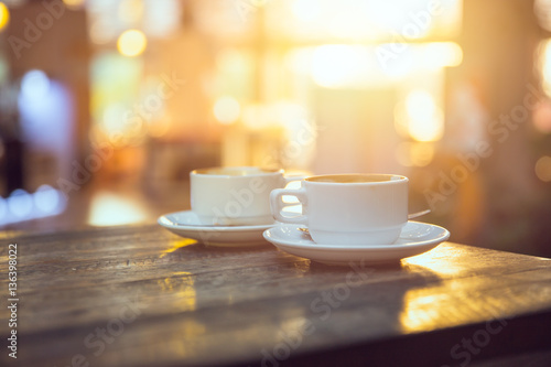 coffee in the morning, two cup of espresso on wood table in cafe or coffeeshop.