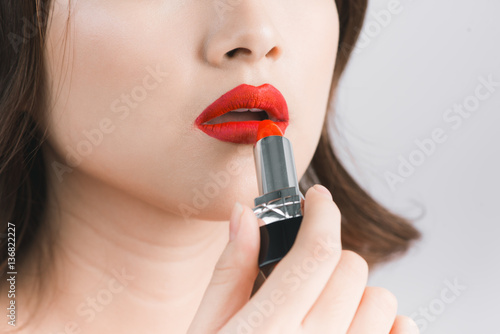 Young asian sexy woman with dark hair using red lipstick Poster