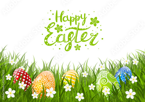 Color Easter eggs on green grass