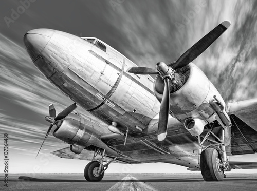 Fototapeta historic airplane on a runway