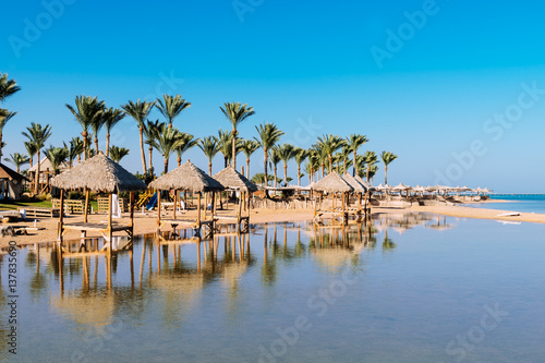  Beautiful beach with palm trees at sunset, Sharm El Sheikh, Red sea, Egypt