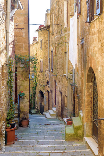  narrow street in the village, Pitigliano, tuscany, italy