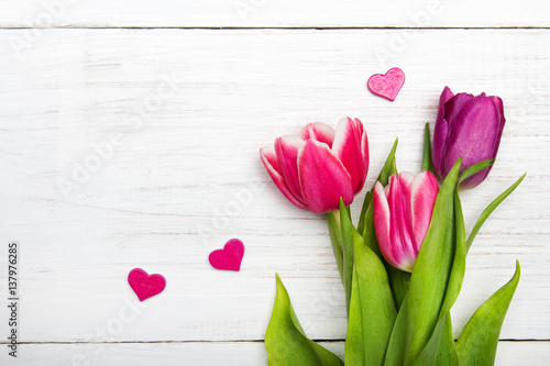 Tulip bouquet on white wooden background, copy space